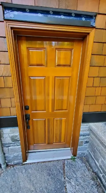 Wood front door with a fresh clear finish