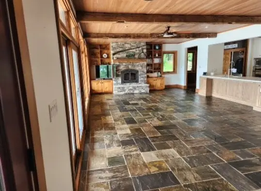 Finished great room with fresh walls and timber ceiling