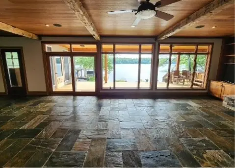 Finished lake-house great room with fresh white walls, a 2025 Heartmind job