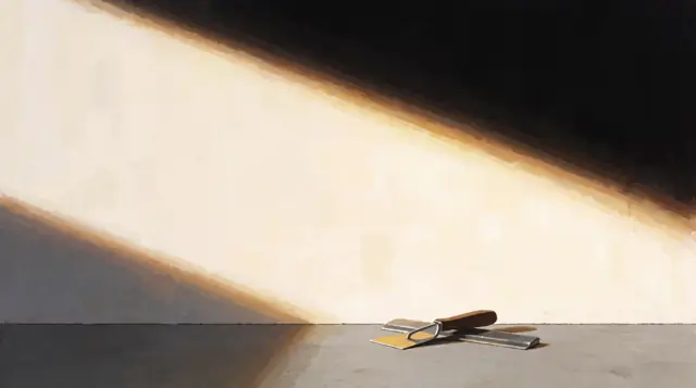 low sunlight across a smooth, seamless wall